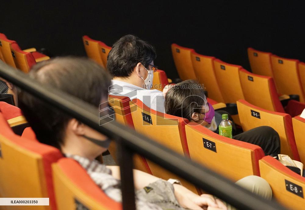 Japan eases virus rule to allow more people at sports, movie venues