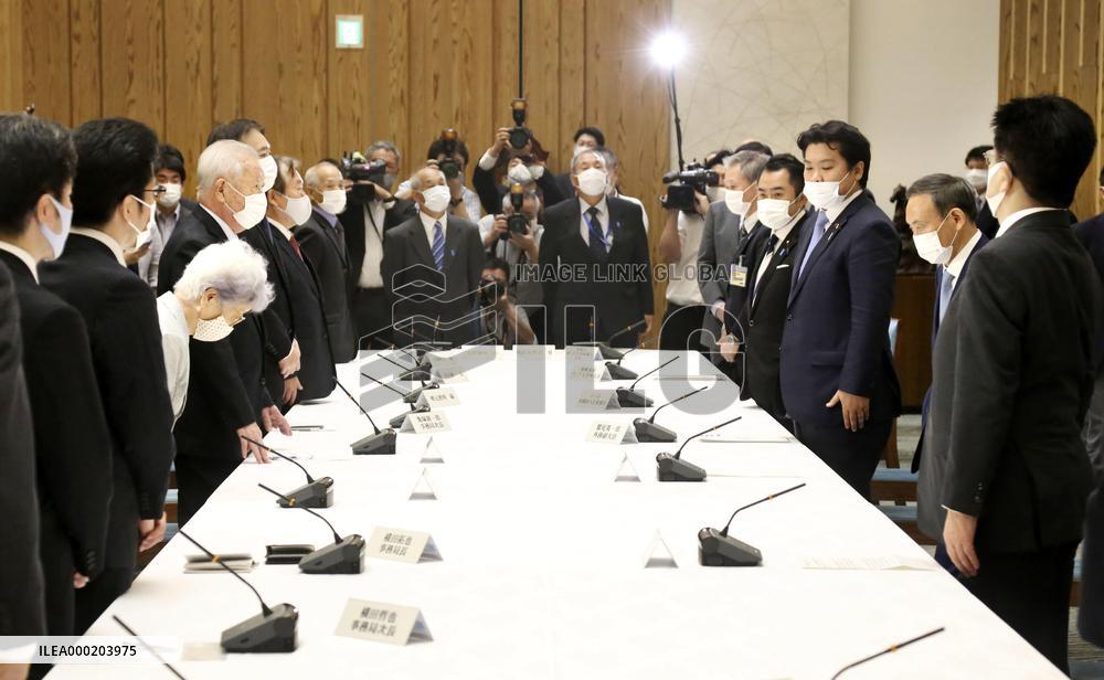 Japan PM Suga meets abductees' kin