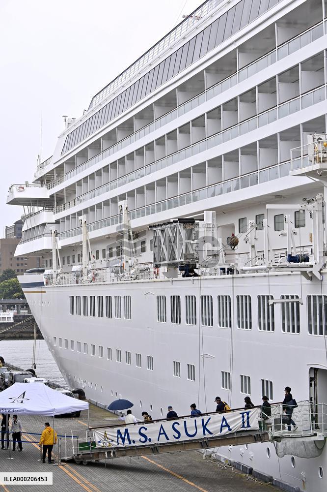 Japan cruise ship returns after passenger tests positive for COVID-19