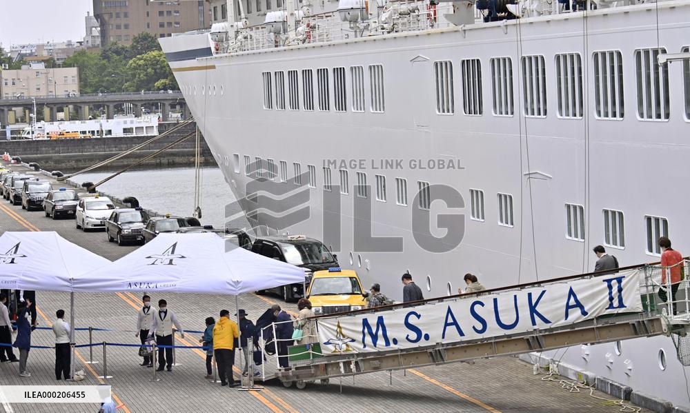 Japan cruise ship returns after passenger tests positive for COVID-19