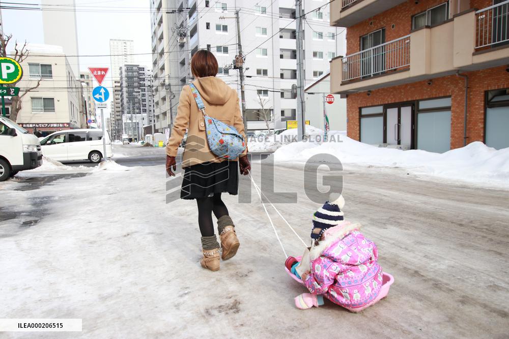 Sledding on a winter road