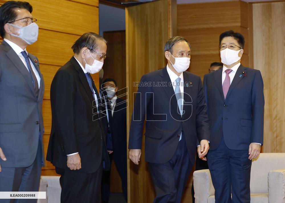 Japan Cabinet OKs 73.6 tril. yen new stimulus to fight virus