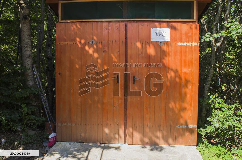 Prokletije National park, Mountains, outdoor squat toilet (flush toilet) with water cistern for flushing, WC, gents and ladies sign