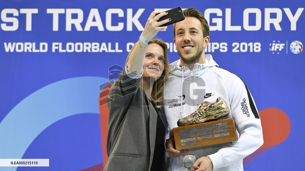 Pascal Meier (Switzerland) with the trophy for the Most useful player poses for a selfie with a fan