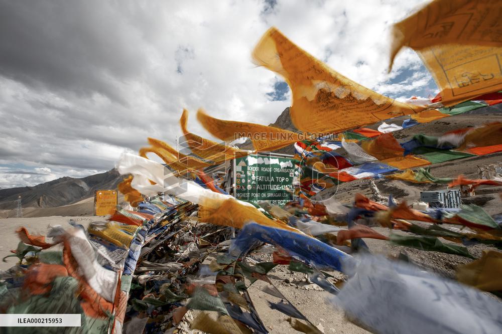 Buddhist prayer flags, Fatula pass, National highway 1D, road, road sign, mountains, Himalayas, Ladakh, Kashmir, India