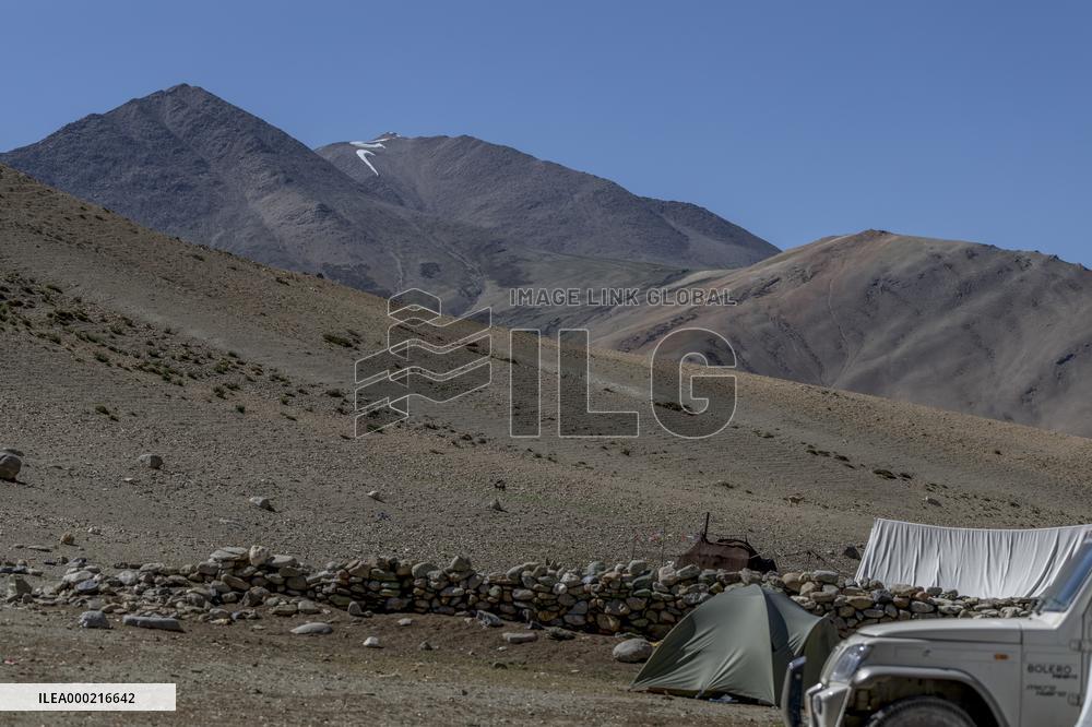 Nike logo, snow cap, mountains, tent, car, Himalyas, Ladakh, Kashmir, India