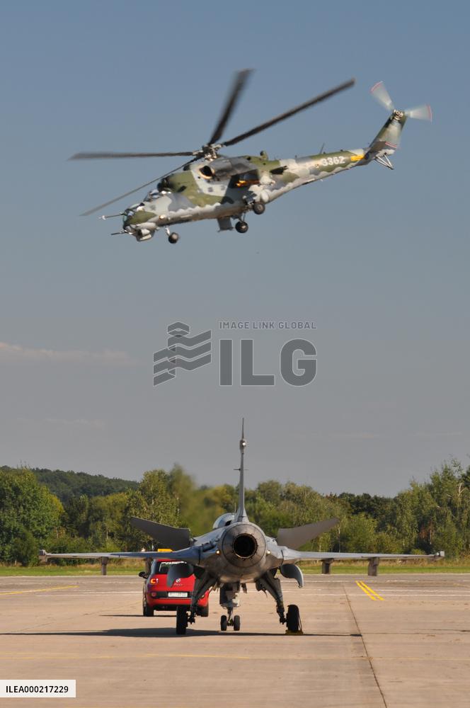 Airplane JAS-39 Gripen with Mi-24 helicopter, airport, Hradec Kralove