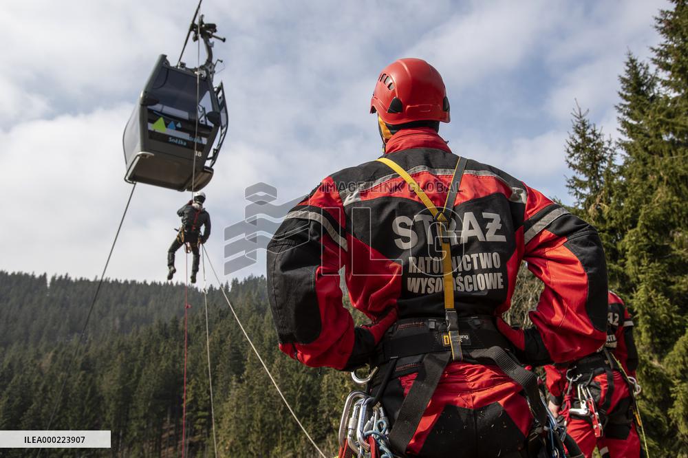 joint exercise of Czech and Polish firefighters on chairlift to Snezka Mountain in the Giant Mountains (Krkonose)