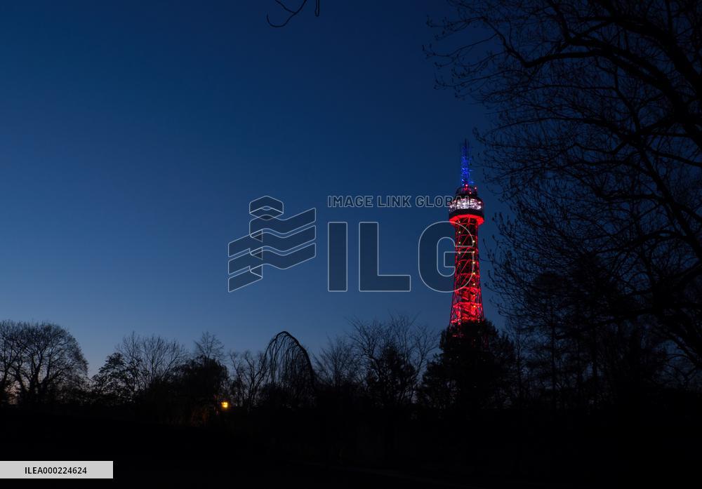 The lookout tower on Petrin hill lit in the French national colours