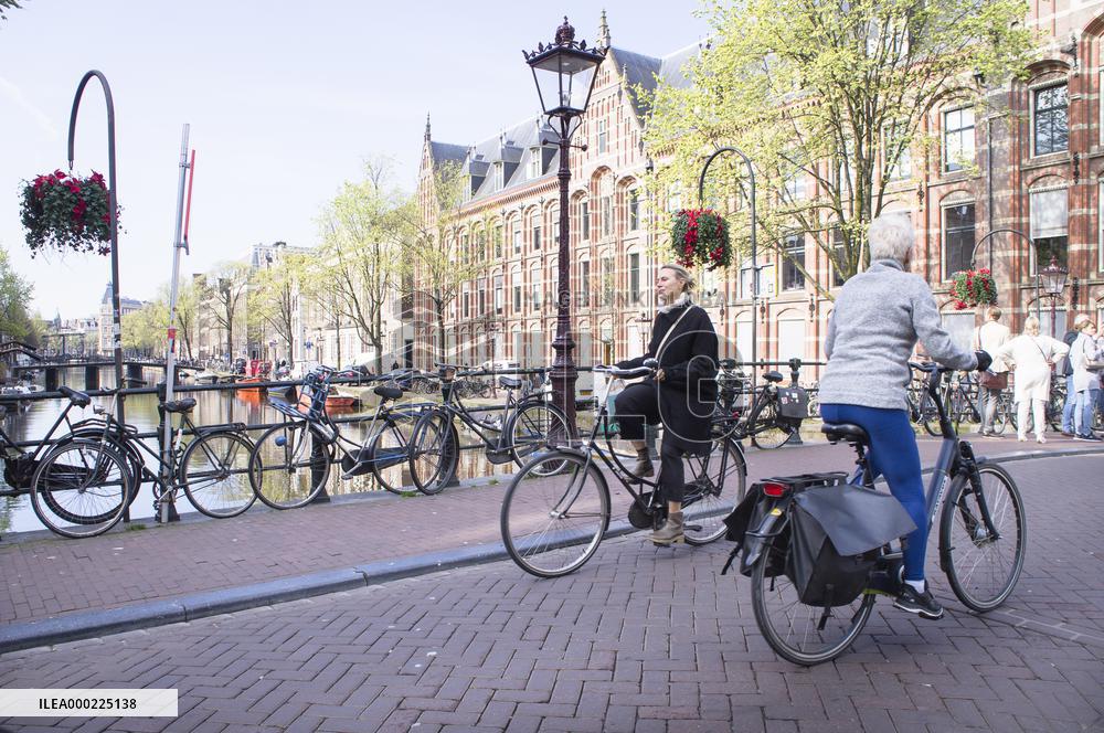 bikes parking on a bridge over a canal