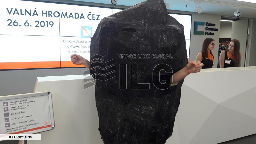 Greenpeace activist in coal costume as a minority shareholder tries to enter annual general meeting of the CEZ Group