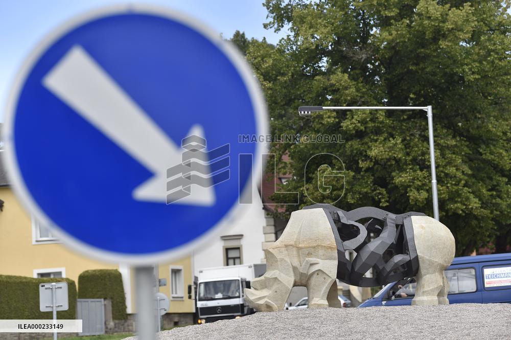 statue of rhino in centre of road circle, representing Sudan, the late last northern white rhinoceros male in the world