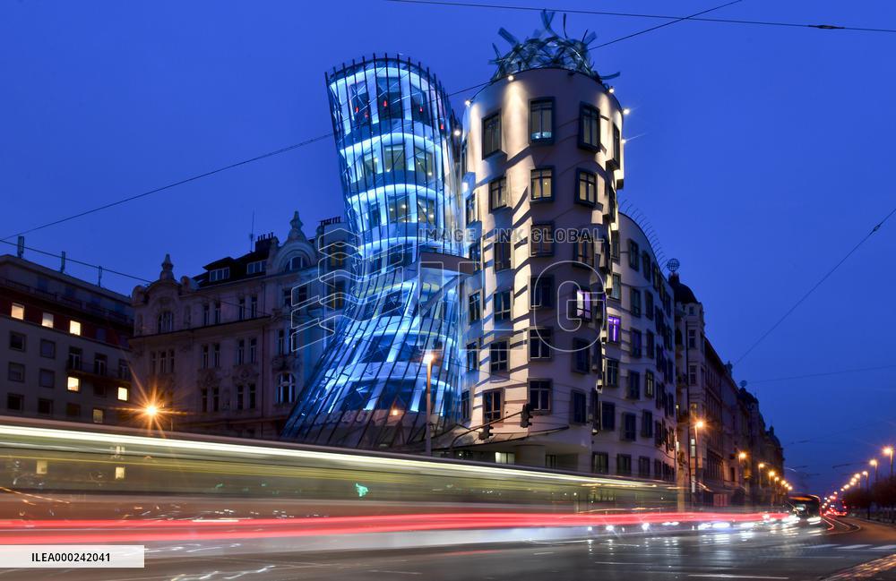 the Dancing House lit in the turquoise colour of the UNICEF