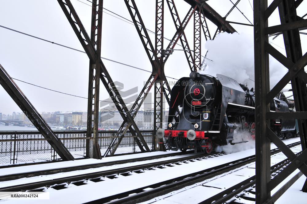 Steam locomotive Skoda 475.179 nickname Slechticna (Noblewoman) on Vysehrad railway bridge over the Vltava River