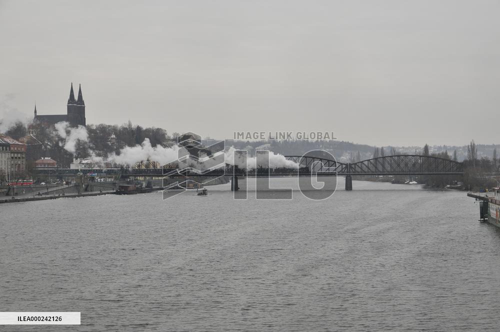 Steam locomotive on Vysehrad railway bridge over the Vltava River