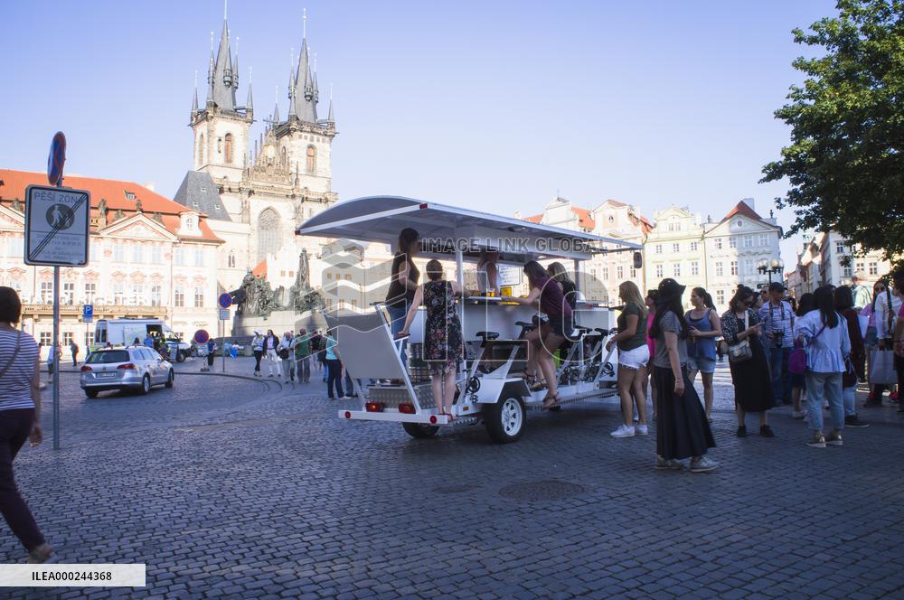 beer bike, car, tourists, Old Town Square