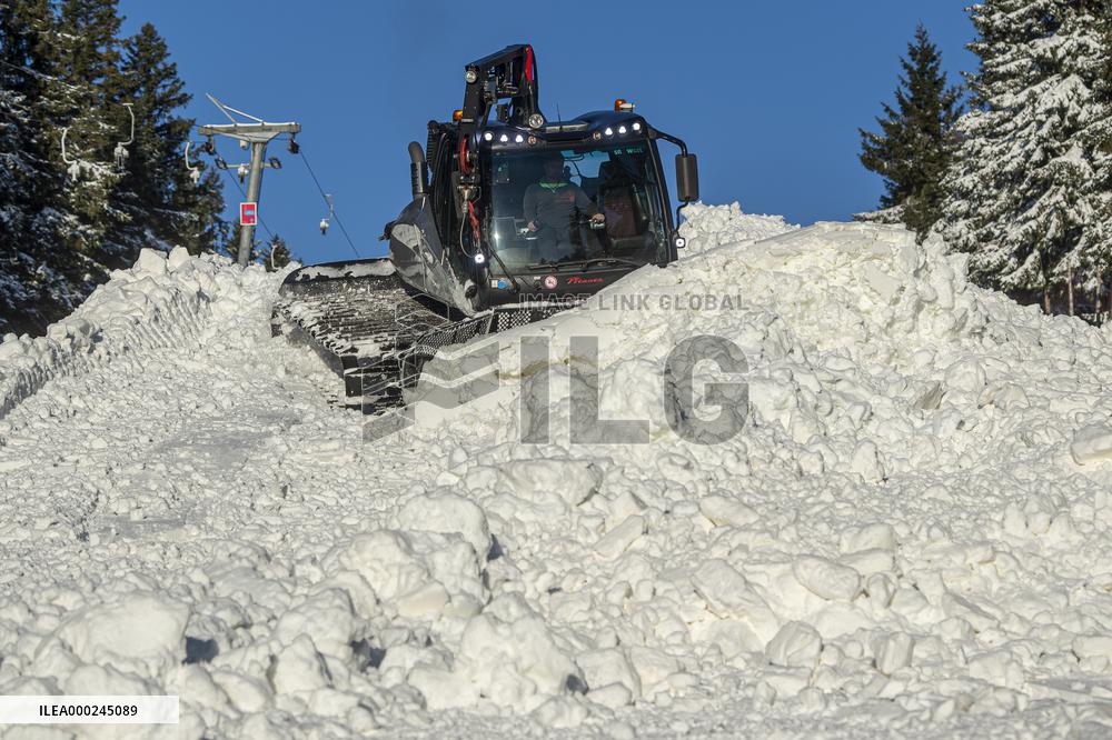 snowcat moves snow in ski resort