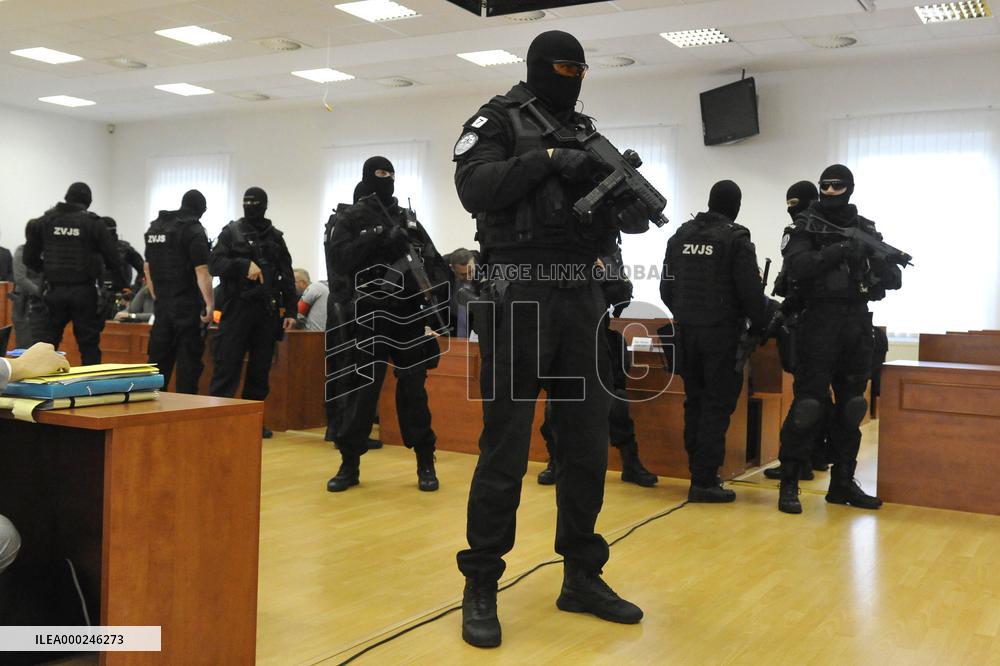 heavily armed members of Prison Service guards in a courtroom