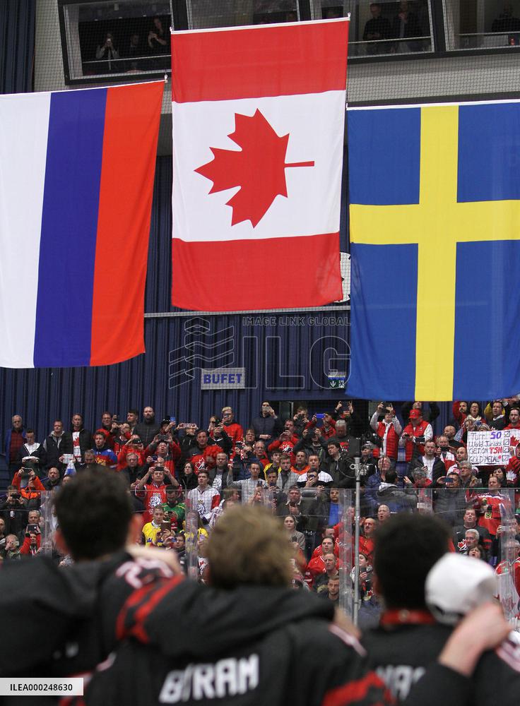 Canadian players follow the national flags of Russia, Canada and Sweden