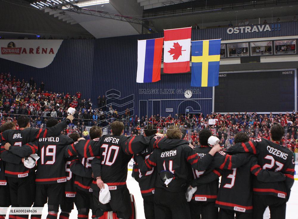 Canadian players follow the national flags of Russia, Canada and Sweden