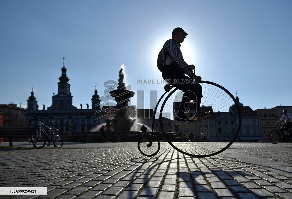 A rider on historic bike on the square of Premysl Otakar II