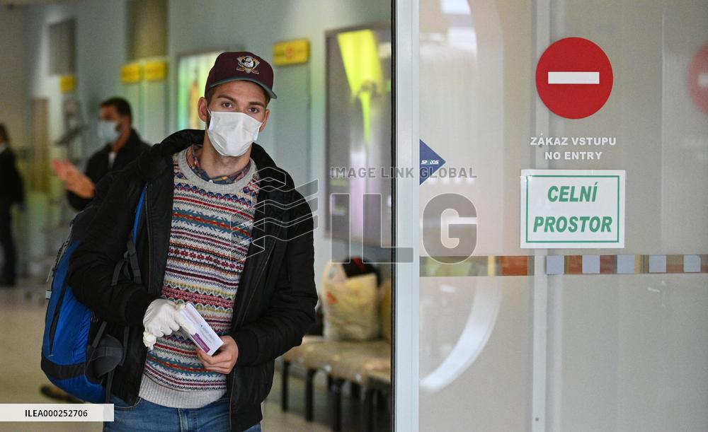 A passenger wearing face mask at the Brno Turany Airport