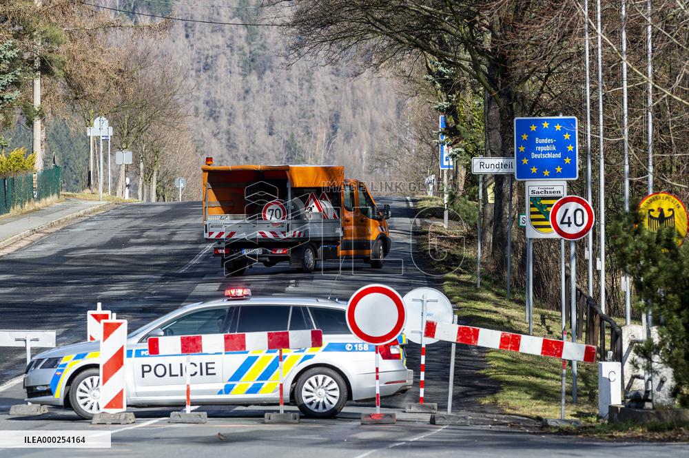 Czech police patrol watch at the closed border crossing Petrovice-Luckendorf