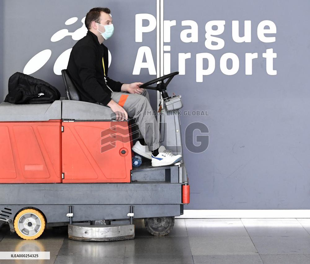 Vaclav Havel Airport Prague, coronavirus, protective medical mask, floor cleaning machine