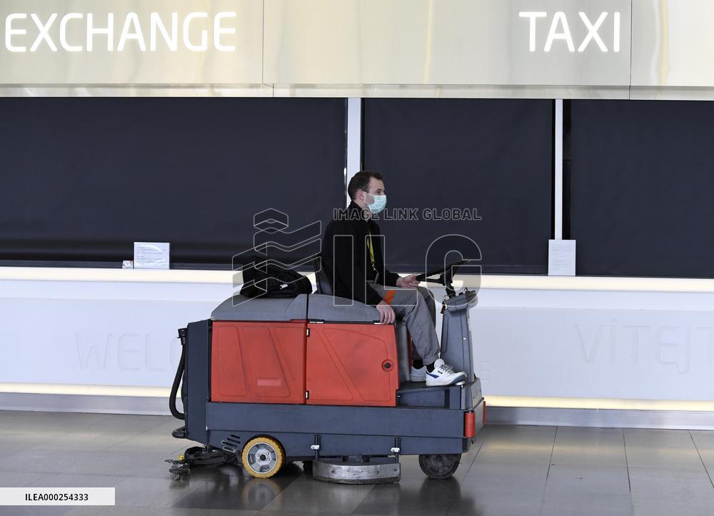 Vaclav Havel Airport Prague, coronavirus, protective medical mask, floor cleaning machine
