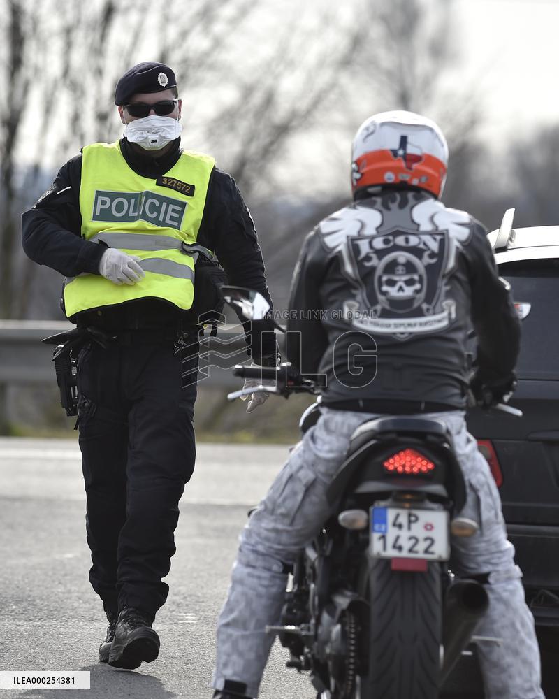 policeman, mask, control, motorbike, driver, at the Bohumin - Chalupki crossing between Poland and the Czech Republic