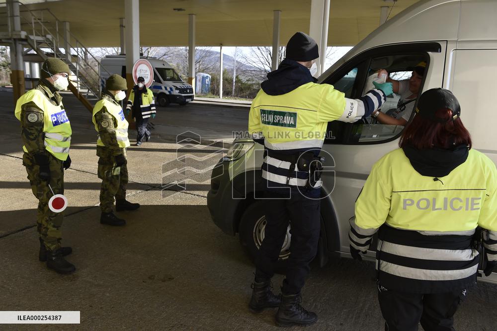 Czech soldiers help police officers guard the Mikulov-Drasenhofen border crossing