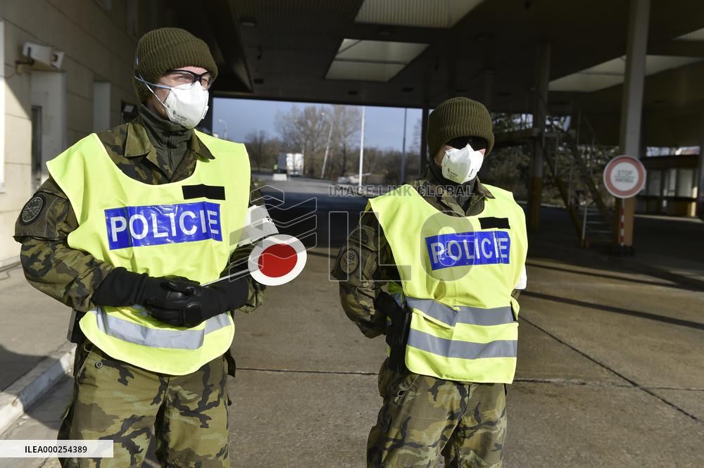 Czech soldiers help police officers guard the Mikulov-Drasenhofen border crossing