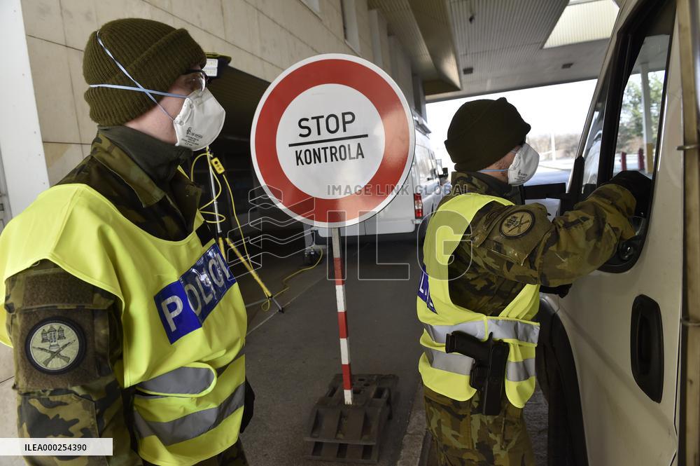 Czech soldiers help police officers guard the Mikulov-Drasenhofen border crossing