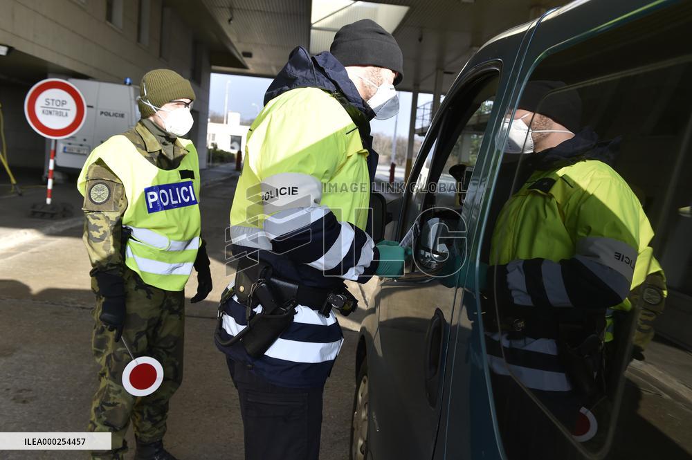 Czech soldiers help police officers guard the Mikulov-Drasenhofen border crossing