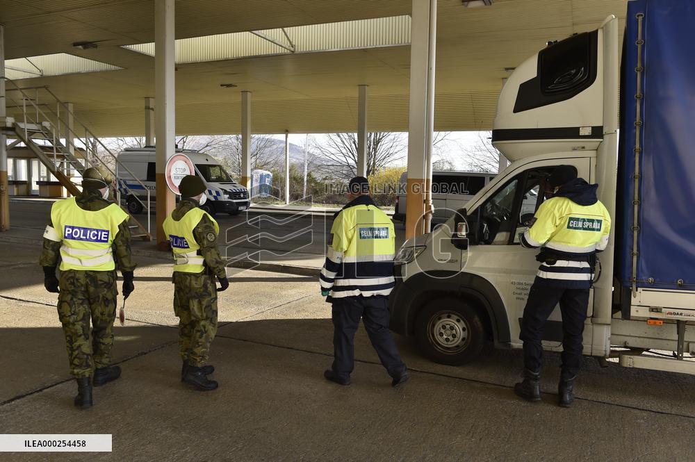 Czech soldiers help police officers guard the Mikulov-Drasenhofen border crossing