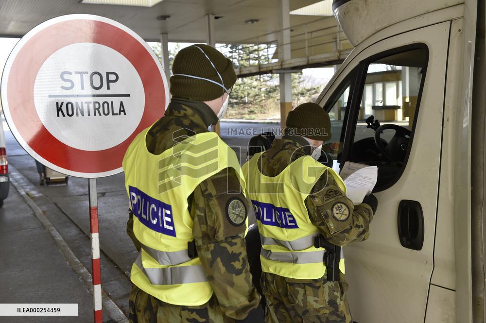 Czech soldiers help police officers guard the Mikulov-Drasenhofen border crossing