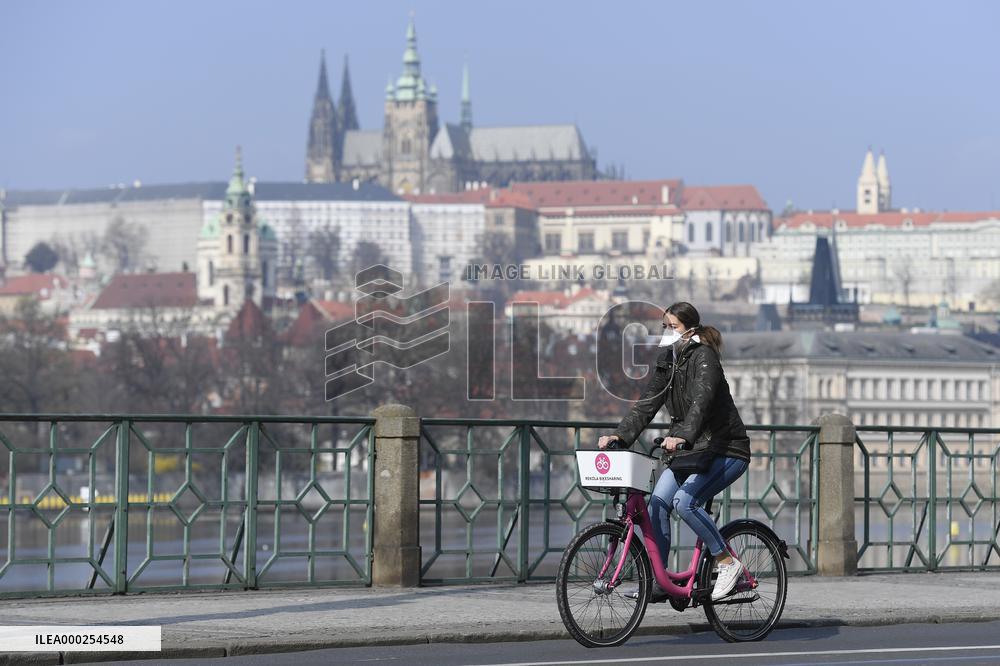 Women, cyclist, Rekola, face mask, epidemic, Coronavirus, Prague Castle, River Vltava
