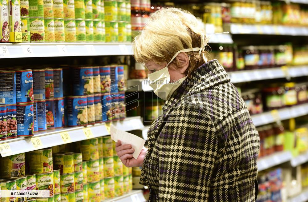 Two hours in food shops, drugstores, pharmacies for seniors only, shop, shopping, senior, protective face mask, woman
