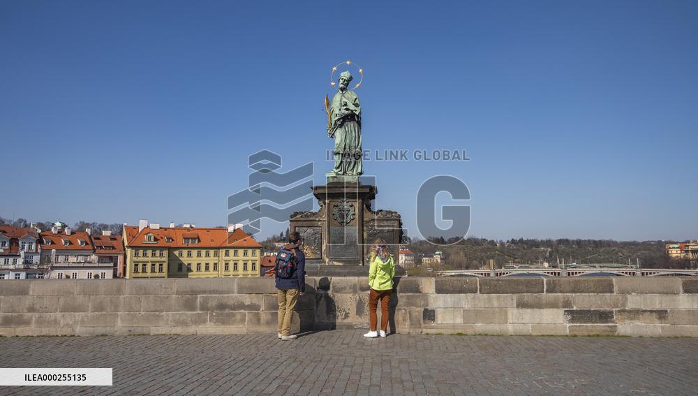 St. John of Nepomuc statue, Charles Bridge, Empty center of Prague, historical center, Prague, city, without tourists, restricted movement of people, travel ban, prevention of infection, Coronavirus, Covid 19