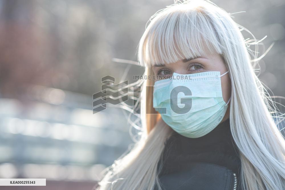 blonde woman with a protection face mask