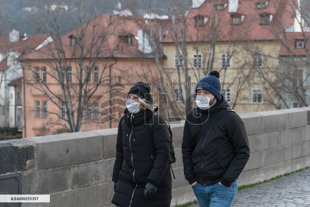 pair of pedestrians with protection face masks on the Charles Bridge in Prague, mask, pedestrian