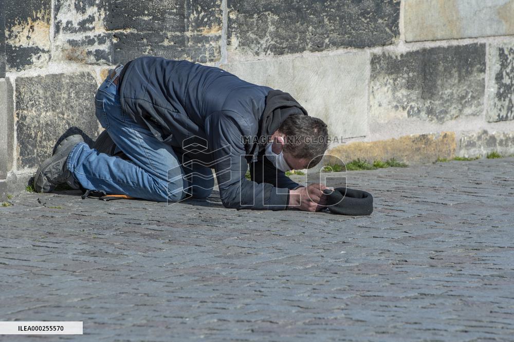 Charles Bridge, beggar, homeless, no tourists, face mask, veil, medical mask