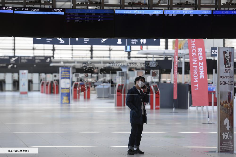 Vaclav Havel Airport Prague, only one passenger is seen in empty departure hall