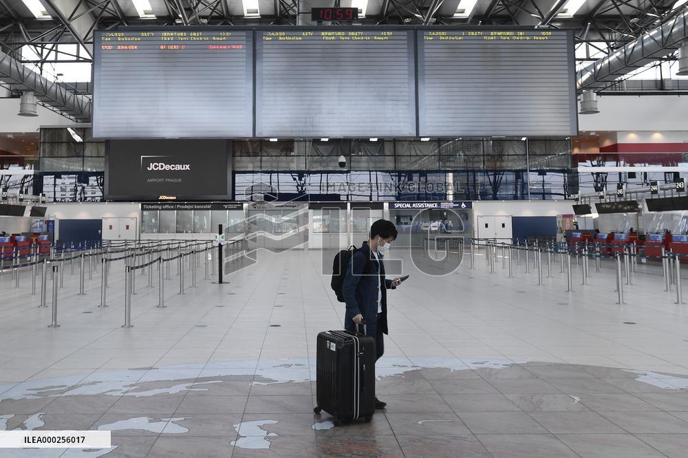Vaclav Havel Airport Prague, only one passenger is seen in empty departure hall