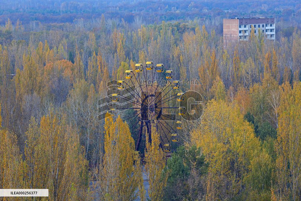 Chernobyl zone, restricted territory, aerial view on deserted town of Pripyat, Ferris wheel