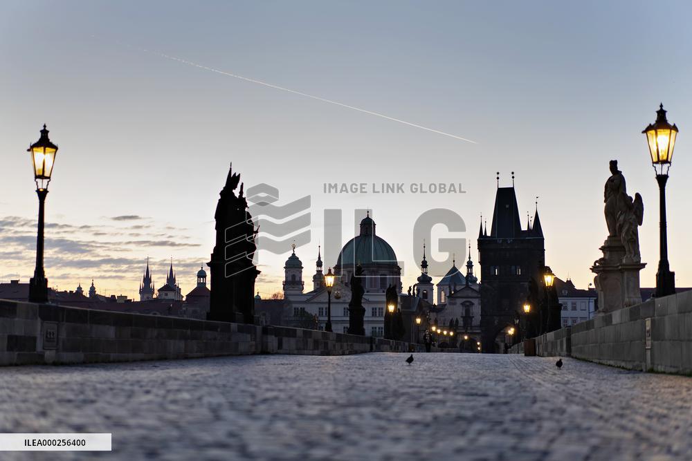 empty Charles Bridge in Prague, sunrise