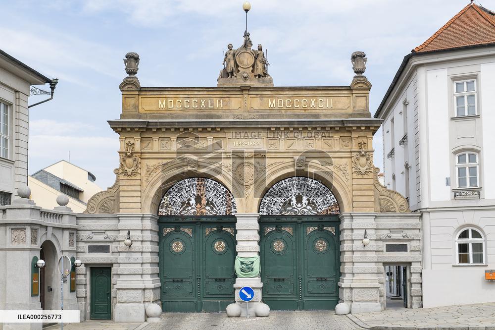 Pilsner Urquell Brewery main gate with a protection face mask