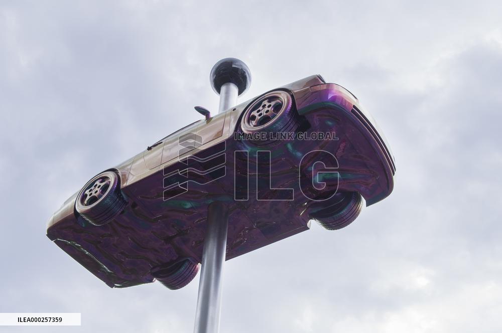 A giant movable car statue Beetle by David Cerny, model Porsche 911