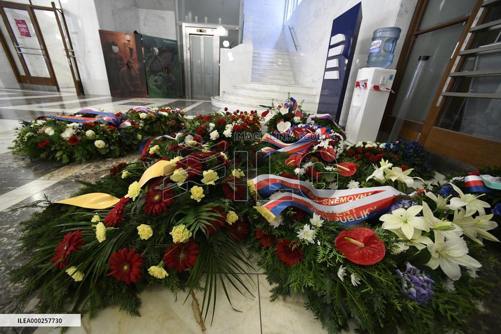 wreaths from Czech state officials lie in the lobby of the Czech Radio building in Prague