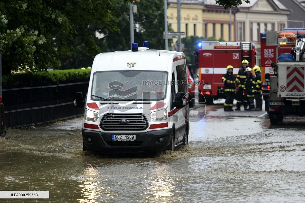 firefighters evacuated the old people's home in Hermanuv Mestec after a nearby pond dam overflowed amid torrential rains